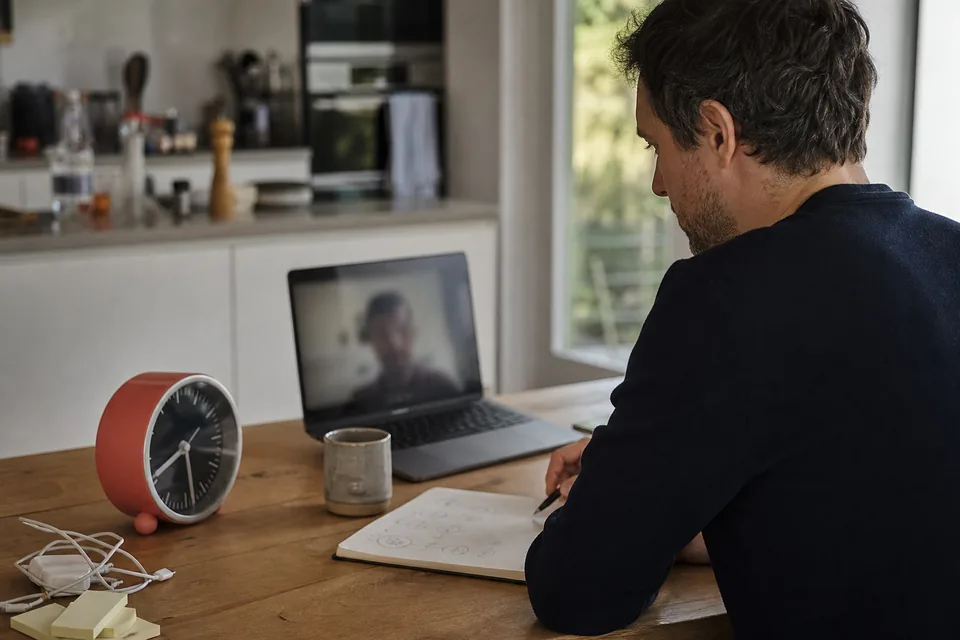 A hiring manager on a video call with a remote JavaScript developer